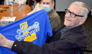 Bill Huff holding Lancaster High School t-shirt