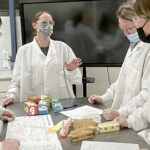 Teacher and students in lab gear