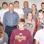 Paul Bell with a group of students in a classroom.