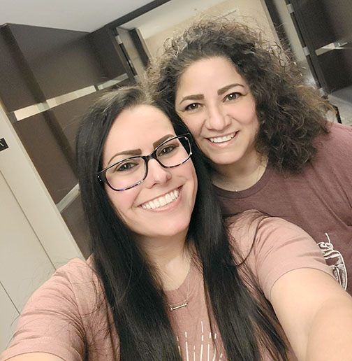 Two women taking a selfie.