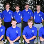Group photo of the golf team, dressed on blue shirts.