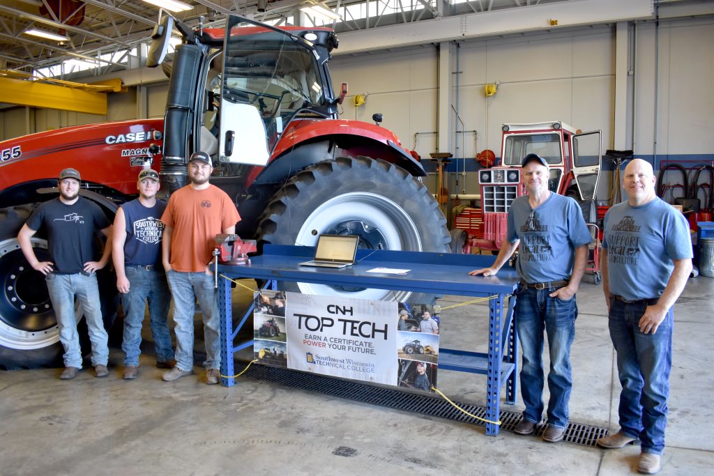 Students pictured with two instructors in Ag Power Lab.