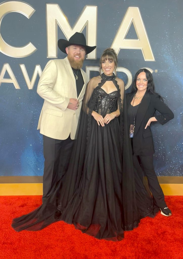 Molly Rivers on the red carpet with Tyler Braden and his wife.