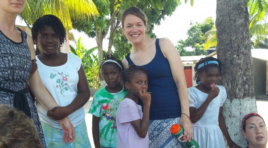 Nursing students and Haitian orphans enjoy eachother's company.