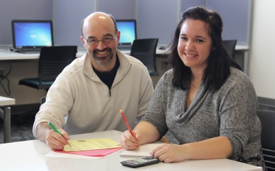 Math instructor assisting a student